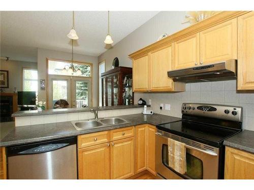 35 Wentworth Gardens Sw, Calgary, AB - Indoor Photo Showing Kitchen With Double Sink