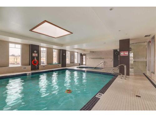 1127-2330 Fish Creek Boulevard Sw, Calgary, AB - Indoor Photo Showing Other Room With In Ground Pool