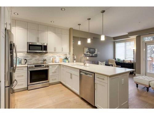 1127-2330 Fish Creek Boulevard Sw, Calgary, AB - Indoor Photo Showing Kitchen With Stainless Steel Kitchen With Upgraded Kitchen