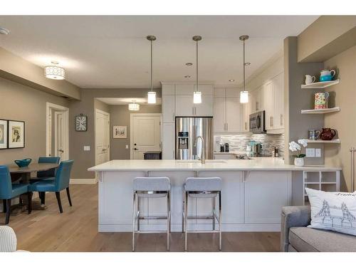 1127-2330 Fish Creek Boulevard Sw, Calgary, AB - Indoor Photo Showing Kitchen With Upgraded Kitchen
