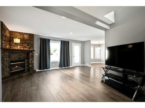 15 Cimarron Meadows Crescent, Okotoks, AB - Indoor Photo Showing Living Room With Fireplace