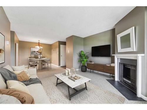1313-315 Southampton Drive Sw, Calgary, AB - Indoor Photo Showing Living Room With Fireplace