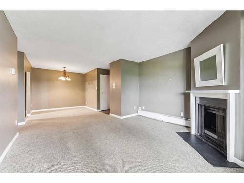 1313-315 Southampton Drive Sw, Calgary, AB - Indoor With Fireplace