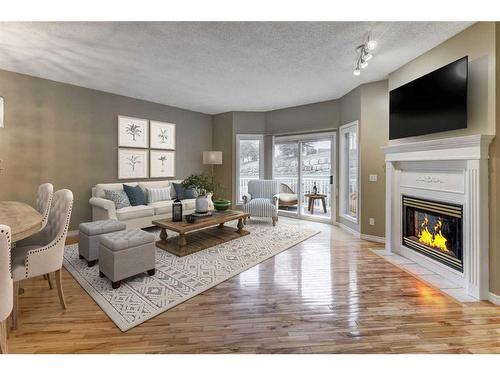 42 Hamptons Link Nw, Calgary, AB - Indoor Photo Showing Living Room With Fireplace