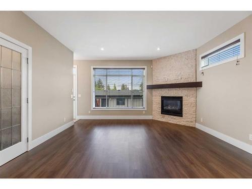 308 26 Avenue Ne, Calgary, AB - Indoor Photo Showing Living Room With Fireplace