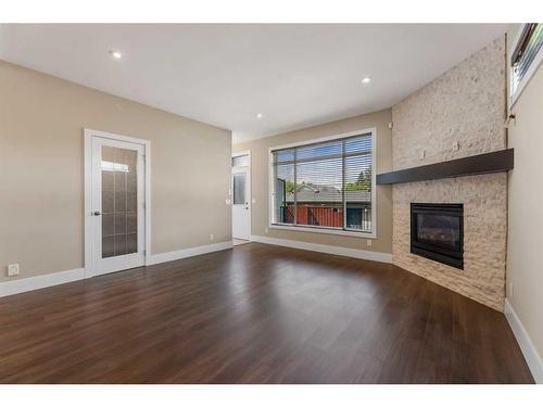 308 26 Avenue Ne, Calgary, AB - Indoor Photo Showing Living Room With Fireplace