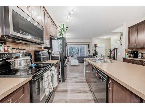 161 Walden Manor Se, Calgary, AB - Indoor Photo Showing Kitchen With Double Sink