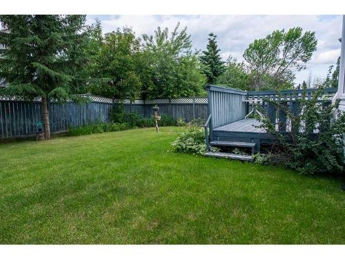 319 Hidden Vale Place Nw, Calgary, AB - Outdoor With Backyard