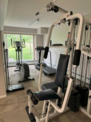 205-5000 Somervale Court Sw, Calgary, AB - Indoor Photo Showing Gym Room
