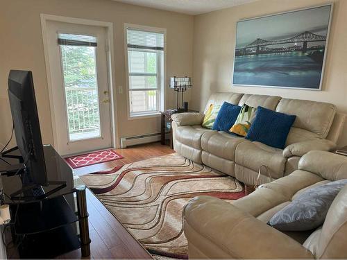 205-5000 Somervale Court Sw, Calgary, AB - Indoor Photo Showing Living Room