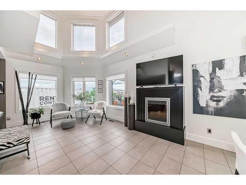 125 Westchester Way, Chestermere, AB - Indoor Photo Showing Living Room With Fireplace