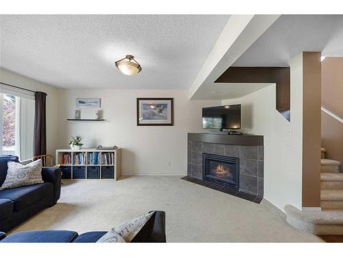 272 Hidden Ranch Circle Nw, Calgary, AB - Indoor Photo Showing Living Room With Fireplace