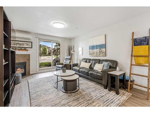 102-30 Cranfield Link Se, Calgary, AB - Indoor Photo Showing Living Room With Fireplace