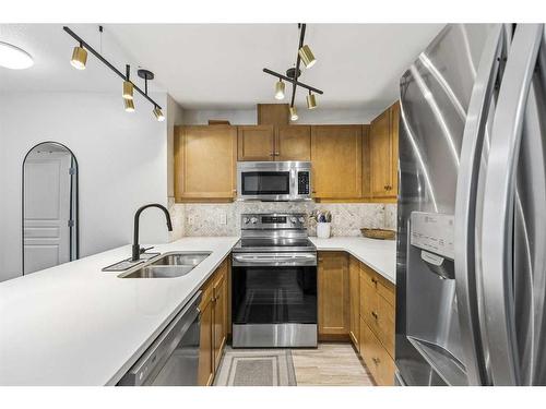 102-30 Cranfield Link Se, Calgary, AB - Indoor Photo Showing Kitchen With Double Sink With Upgraded Kitchen