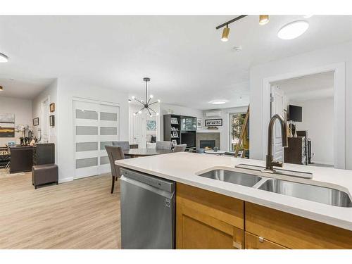 102-30 Cranfield Link Se, Calgary, AB - Indoor Photo Showing Kitchen With Double Sink