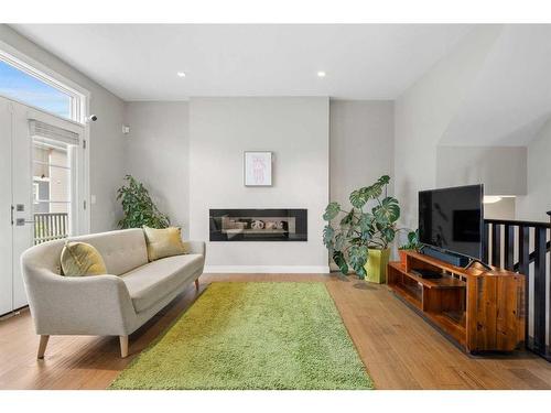 831 85 Street Sw, Calgary, AB - Indoor Photo Showing Living Room With Fireplace