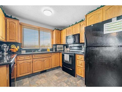 6 Golden Key Estates, Rural Rocky View County, AB - Indoor Photo Showing Kitchen With Double Sink