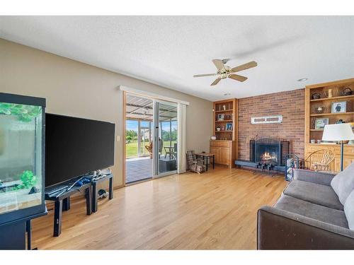 6 Golden Key Estates, Rural Rocky View County, AB - Indoor Photo Showing Living Room With Fireplace