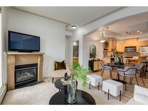 406-1315 12 Avenue Sw, Calgary, AB - Indoor Photo Showing Living Room With Fireplace