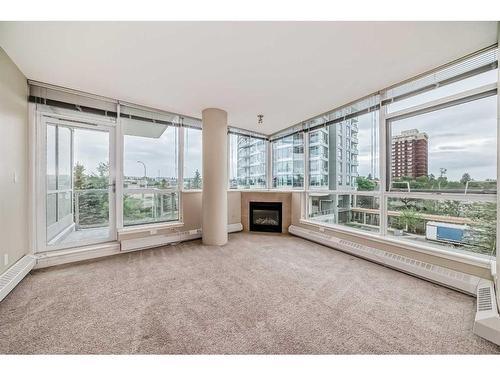 306-77 Spruce Place Sw, Calgary, AB - Indoor With Fireplace