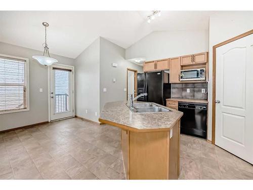 86 Silverado Saddle Crescent Sw, Calgary, AB - Indoor Photo Showing Kitchen With Double Sink