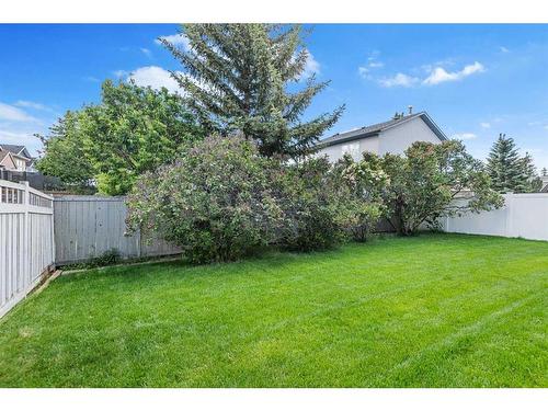 105 Somerset Close Sw, Calgary, AB - Outdoor With Backyard
