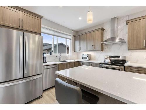 59 Wolf Creek Manor Se, Calgary, AB - Indoor Photo Showing Kitchen With Upgraded Kitchen