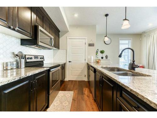 135 Savanna Walk Ne, Calgary, AB - Indoor Photo Showing Kitchen With Double Sink With Upgraded Kitchen