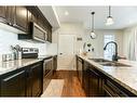 135 Savanna Walk Ne, Calgary, AB  - Indoor Photo Showing Kitchen With Double Sink With Upgraded Kitchen 