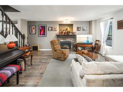 362 Copperfield Grove Se, Calgary, AB - Indoor Photo Showing Living Room With Fireplace