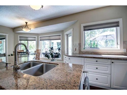 55 Mckenzie Lake Landing Se, Calgary, AB - Indoor Photo Showing Kitchen With Double Sink