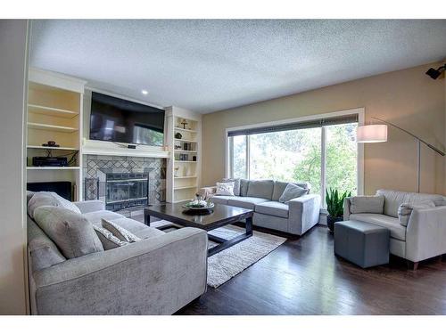 55 Mckenzie Lake Landing Se, Calgary, AB - Indoor Photo Showing Living Room With Fireplace