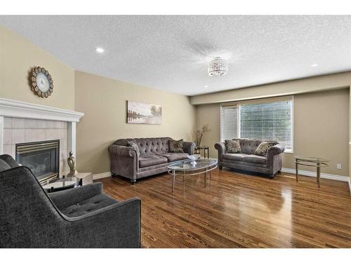 10971 Valley Ridge Drive Nw, Calgary, AB - Indoor Photo Showing Living Room With Fireplace