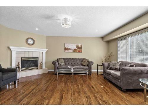 10971 Valley Ridge Drive Nw, Calgary, AB - Indoor Photo Showing Living Room With Fireplace