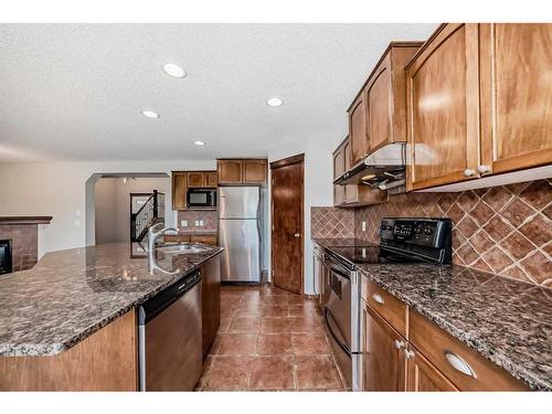 328 Eversyde Way Sw, Calgary, AB - Indoor Photo Showing Kitchen With Double Sink With Upgraded Kitchen