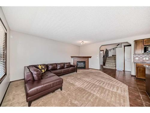 328 Eversyde Way Sw, Calgary, AB - Indoor With Fireplace