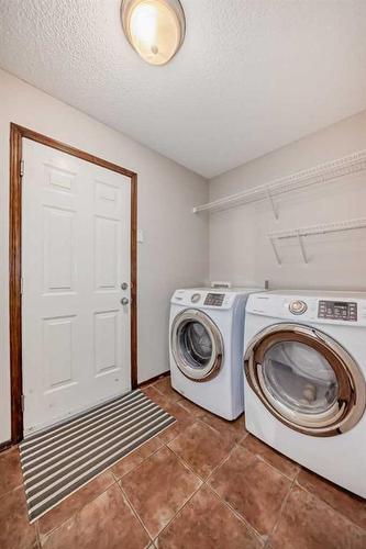 328 Eversyde Way Sw, Calgary, AB - Indoor Photo Showing Laundry Room