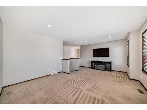 328 Eversyde Way Sw, Calgary, AB - Indoor With Fireplace