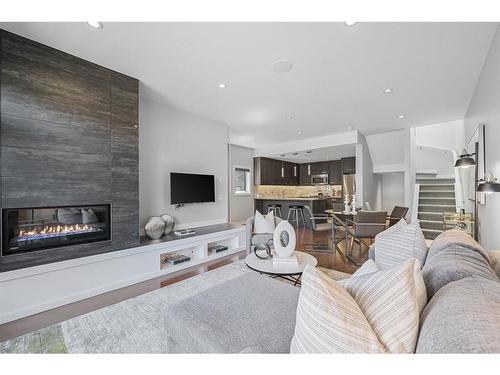 2-1818 Kensington Road Nw, Calgary, AB - Indoor Photo Showing Living Room With Fireplace