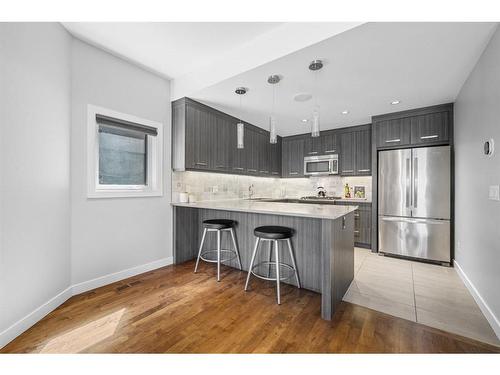 2-1818 Kensington Road Nw, Calgary, AB - Indoor Photo Showing Kitchen With Stainless Steel Kitchen With Upgraded Kitchen