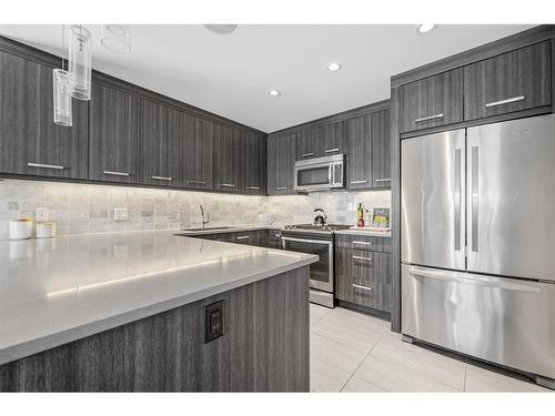 2-1818 Kensington Road Nw, Calgary, AB - Indoor Photo Showing Kitchen With Stainless Steel Kitchen With Upgraded Kitchen