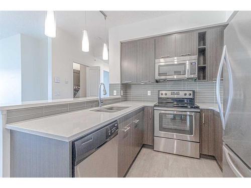 1304-175 Silverado Boulevard Sw, Calgary, AB - Indoor Photo Showing Kitchen With Stainless Steel Kitchen With Double Sink With Upgraded Kitchen