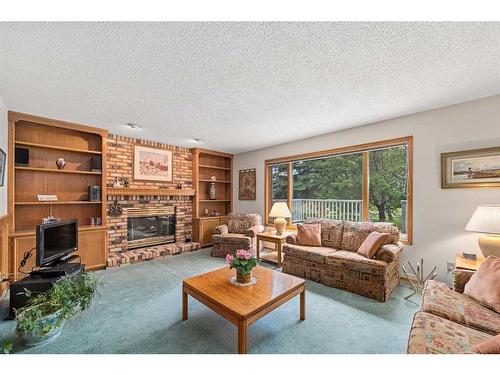1252 Deer River Circle Se, Calgary, AB - Indoor Photo Showing Living Room With Fireplace