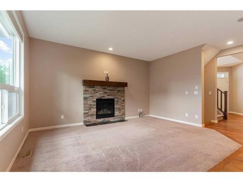 34 Cranarch Landing Se, Calgary, AB - Indoor Photo Showing Living Room With Fireplace