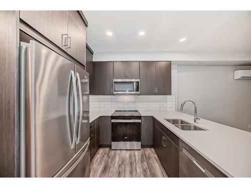 103-55 Wolf Hollow Crescent Se, Calgary, AB - Indoor Photo Showing Kitchen With Double Sink With Upgraded Kitchen