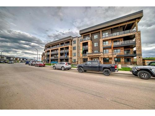 103-55 Wolf Hollow Crescent Se, Calgary, AB - Outdoor With Balcony With Facade