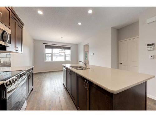 77 Cranford Place Se, Calgary, AB - Indoor Photo Showing Kitchen With Double Sink