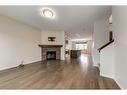 77 Cranford Place Se, Calgary, AB  - Indoor Photo Showing Living Room With Fireplace 