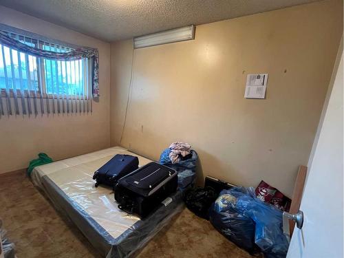 1304 Pennsburg Road Se, Calgary, AB - Indoor Photo Showing Bedroom