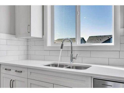 143 Amblefield Avenue Nw, Calgary, AB - Indoor Photo Showing Kitchen With Double Sink